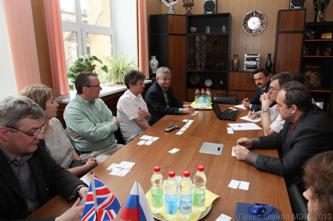 During negotiation with delegation of Glyndwr University (UK).